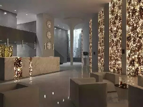 Backlit Yellow Agate Hotel Lobby Design