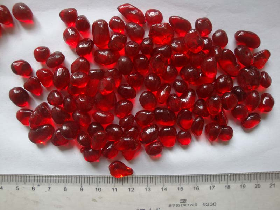 red glass beads particle