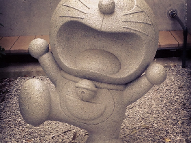 stone doraemon sculpture