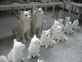 Carved sitting dogs